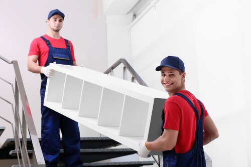 Furniture removals team planning a move in Elephant and Castle apartment building