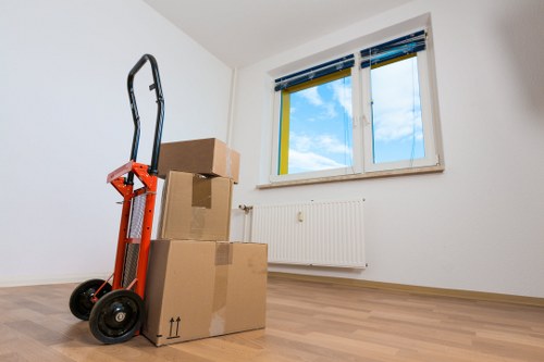 Local team collecting sofas, beds, and wardrobes from a London property