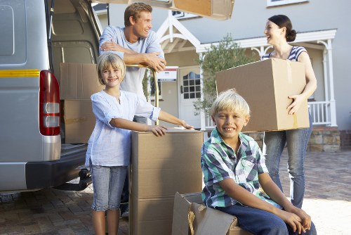 Packed boxes and furniture ready for a local home removal service